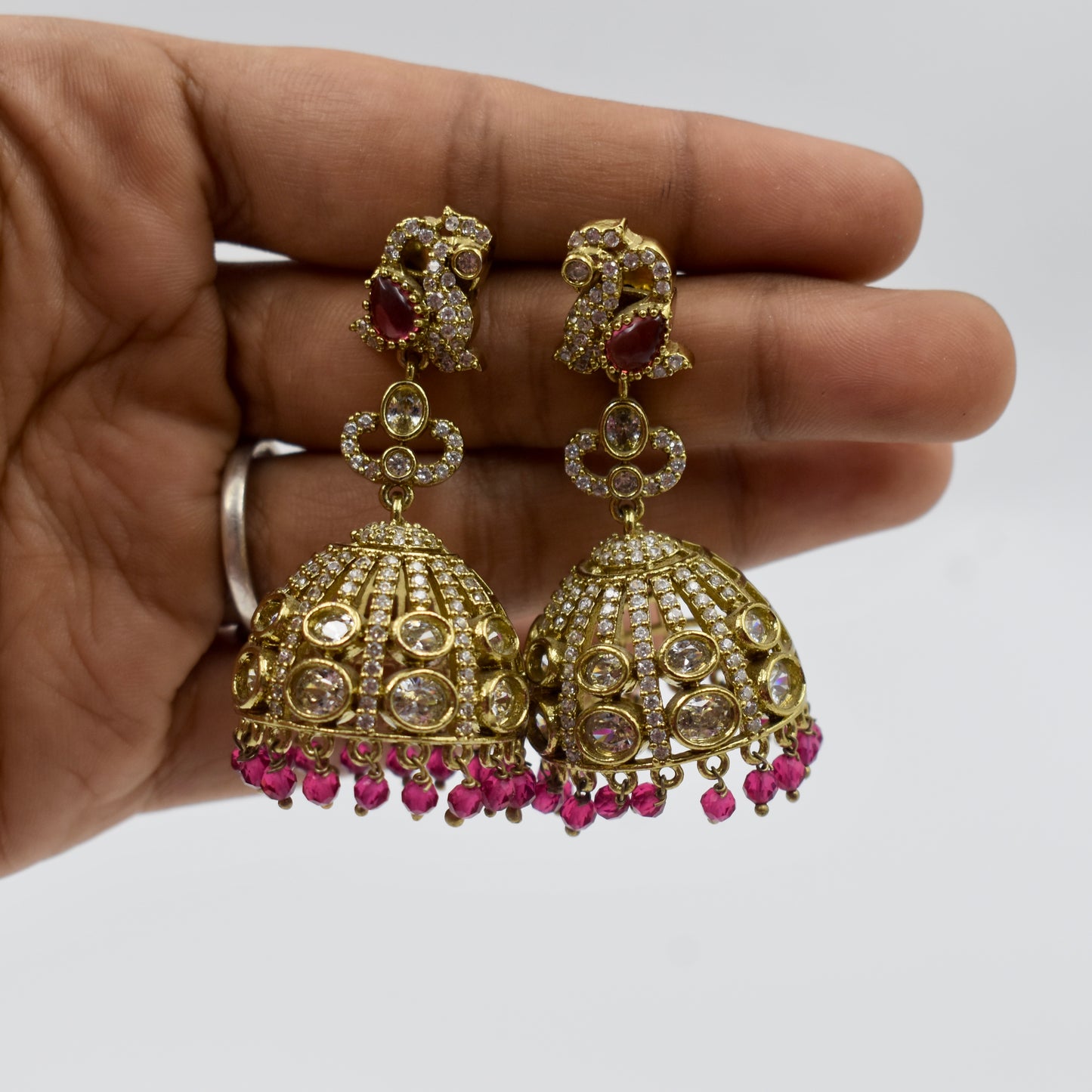 Gold-Plated Ruby Red Stone Jhumka Earrings with Kundan & Crystal Work