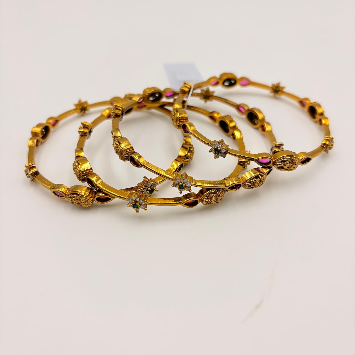 Temple Lakshmi Gold-Plated Bangles with Ruby & Green Stones – Traditional Bridal Wear (Set of 4)