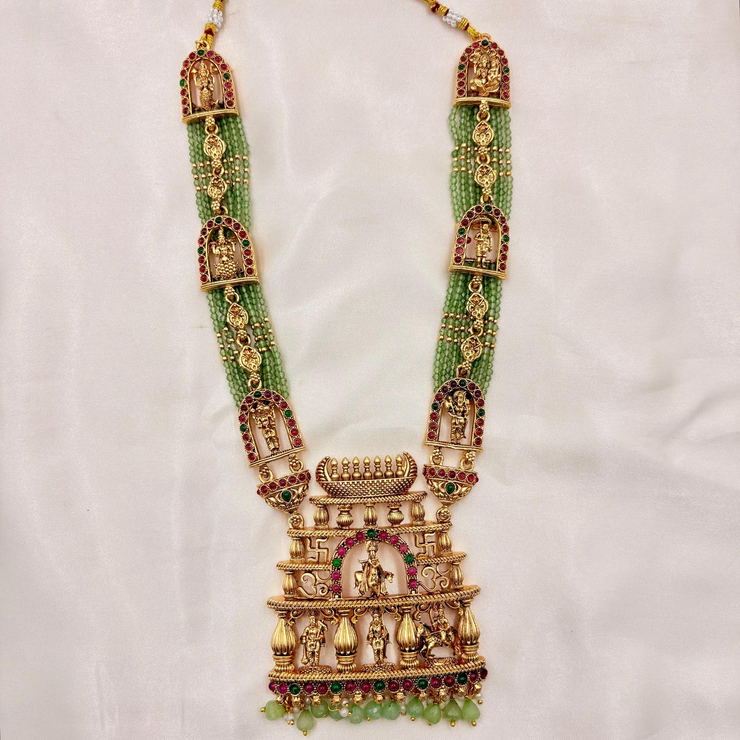 Grand Temple Jewellery Green Beads Haaram with Ram Darbar Pendant & Jhumka Earrings | Antique Gold Finish