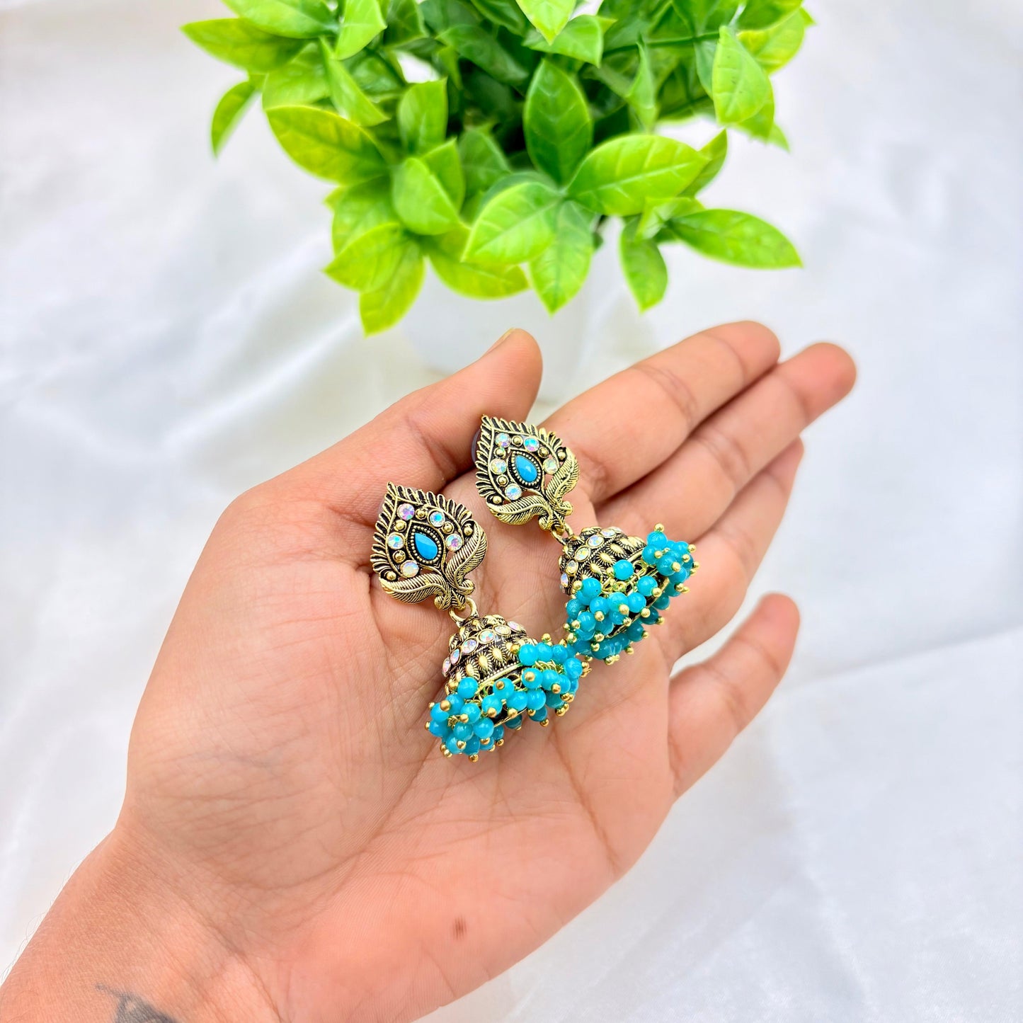 Peacock Motif Antique Gold Jhumka Earrings with Turquoise Beads