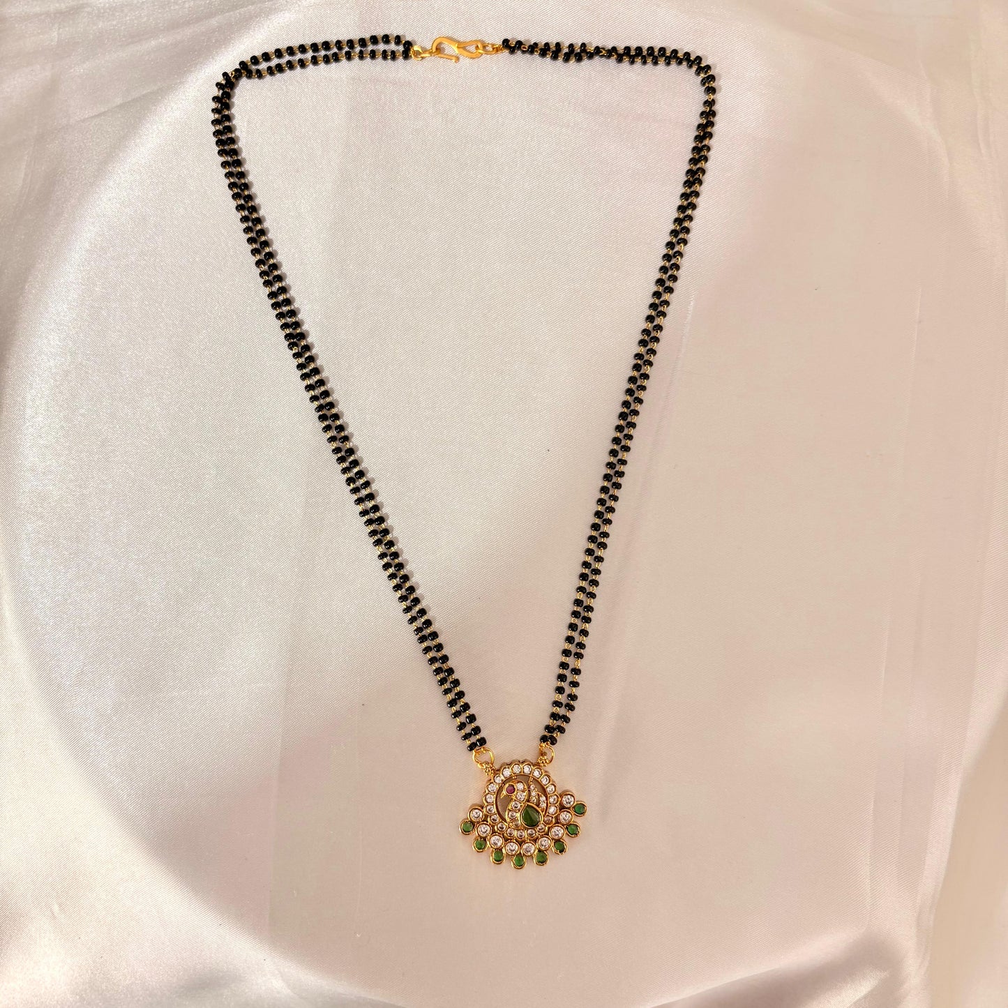 Traditional Black Bead Mangalsutra with CZ & Green Stone Peacock Pendant