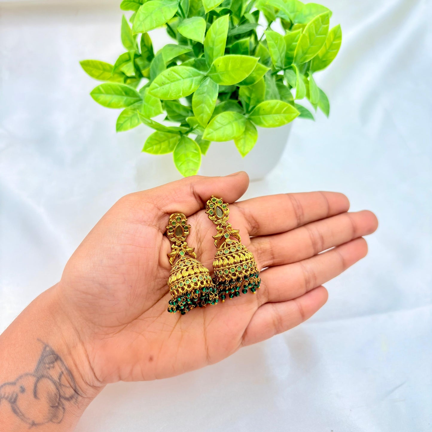 Antique Gold Temple Jhumka Earrings with Green Stone & Bead Drops