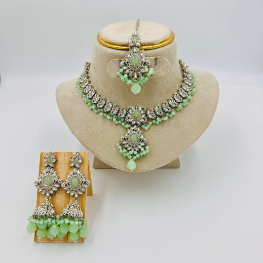 Silver-Plated Green Stone Kundan Choker Necklace Set with Jhumka Earrings & Maang Tikka