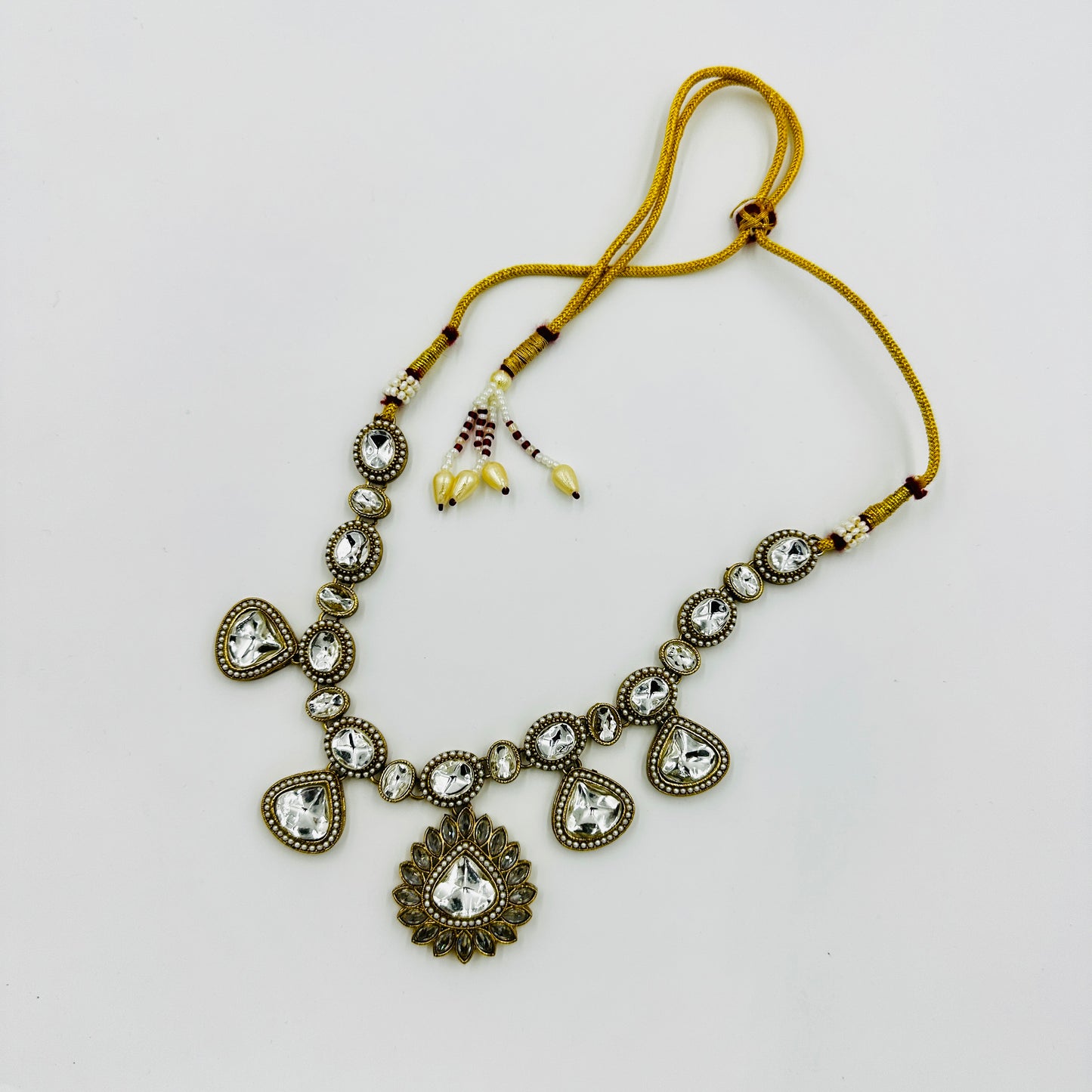 Antique Gold-Plated Kundan Necklace Set with Teardrop Stones & Maang Tikka