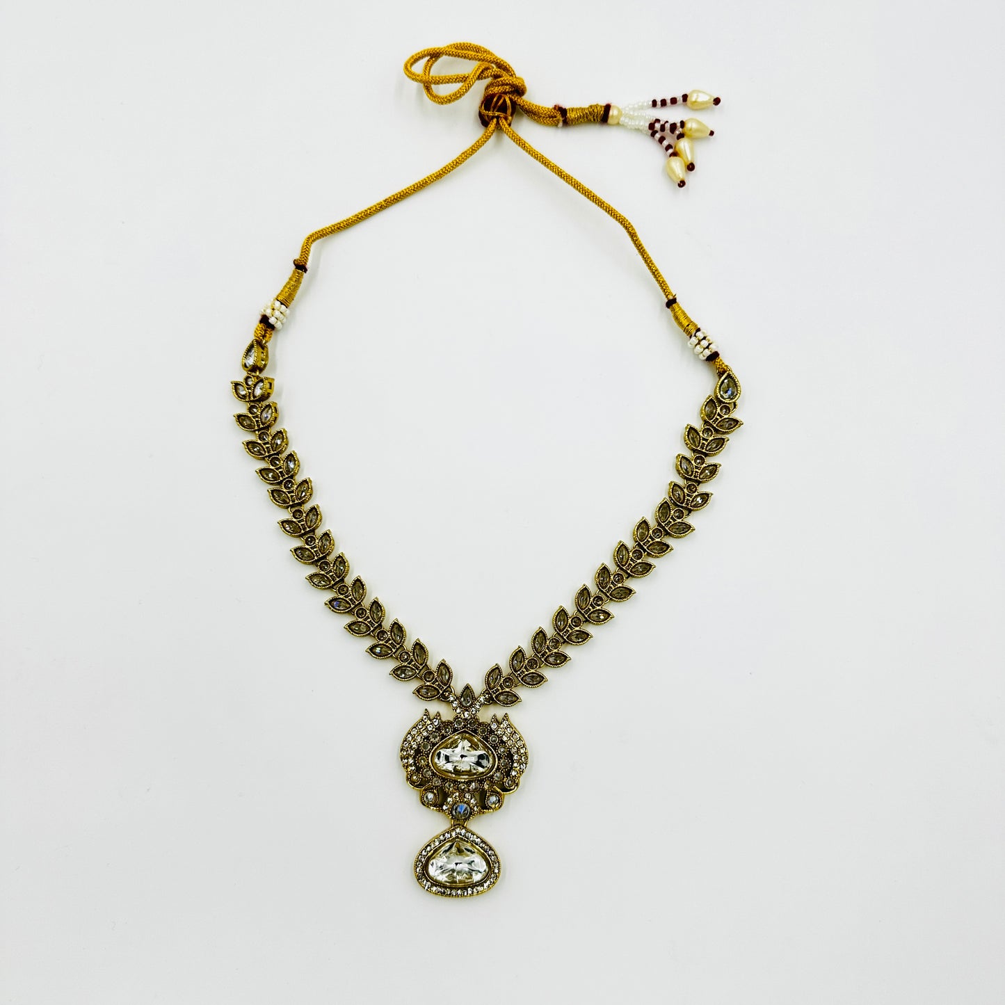 Antique Gold-Plated Kundan Necklace Set with Statement Earrings & Maang Tikka