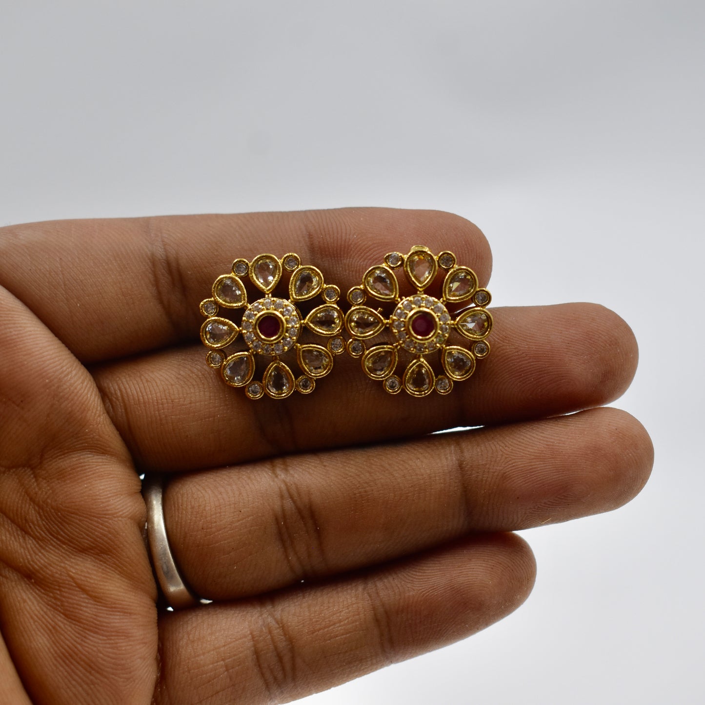 Gold-Plated Floral Kundan Stud Earrings with Ruby Red Center