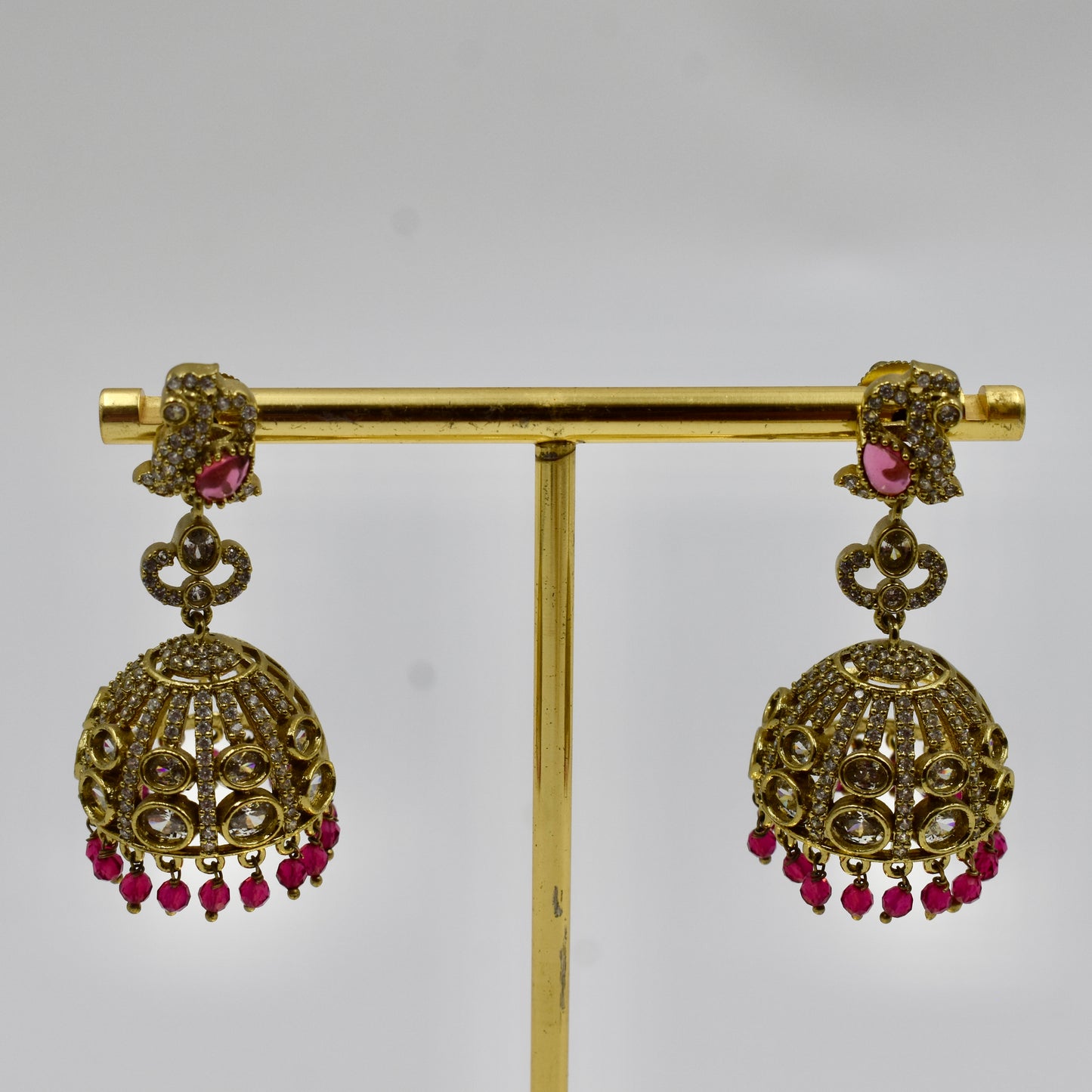 Gold-Plated Ruby Red Stone Jhumka Earrings with Kundan & Crystal Work
