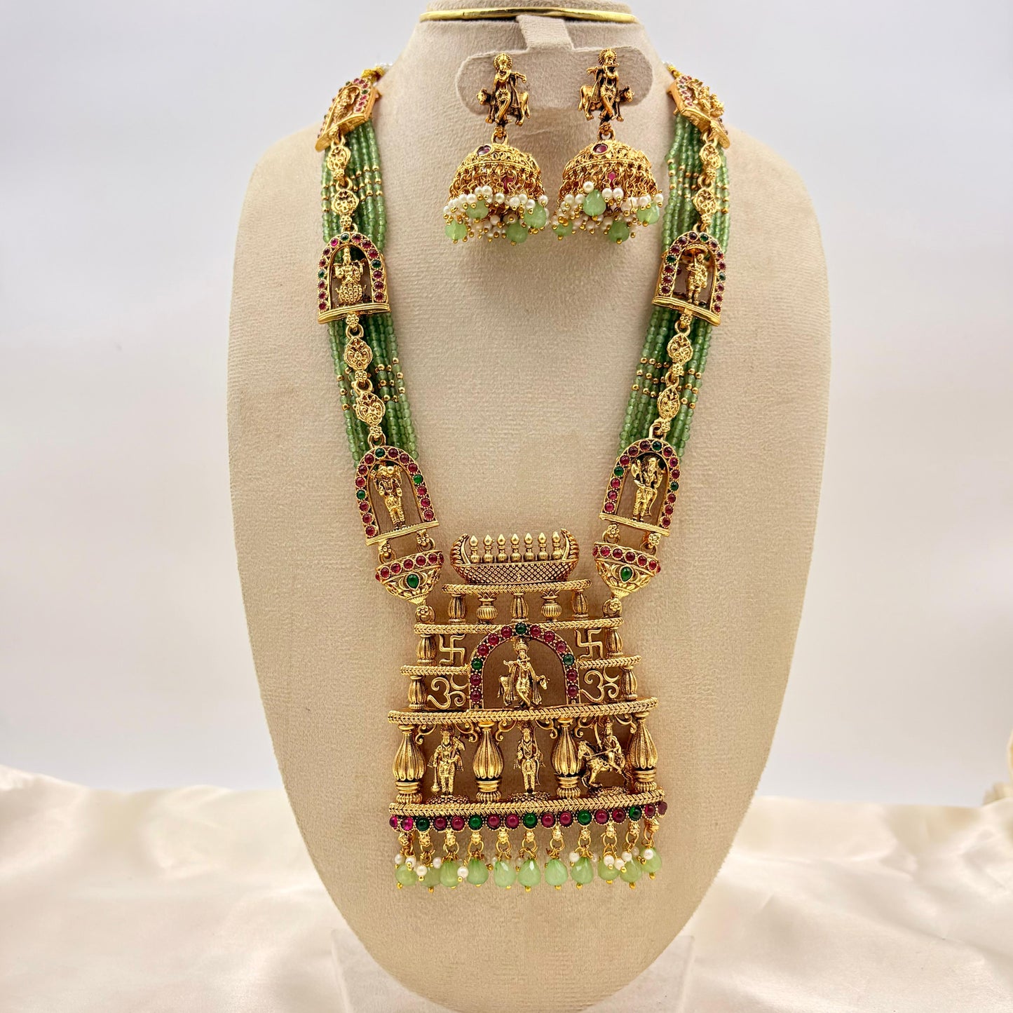 Grand Temple Jewellery Green Beads Haaram with Ram Darbar Pendant & Jhumka Earrings | Antique Gold Finish