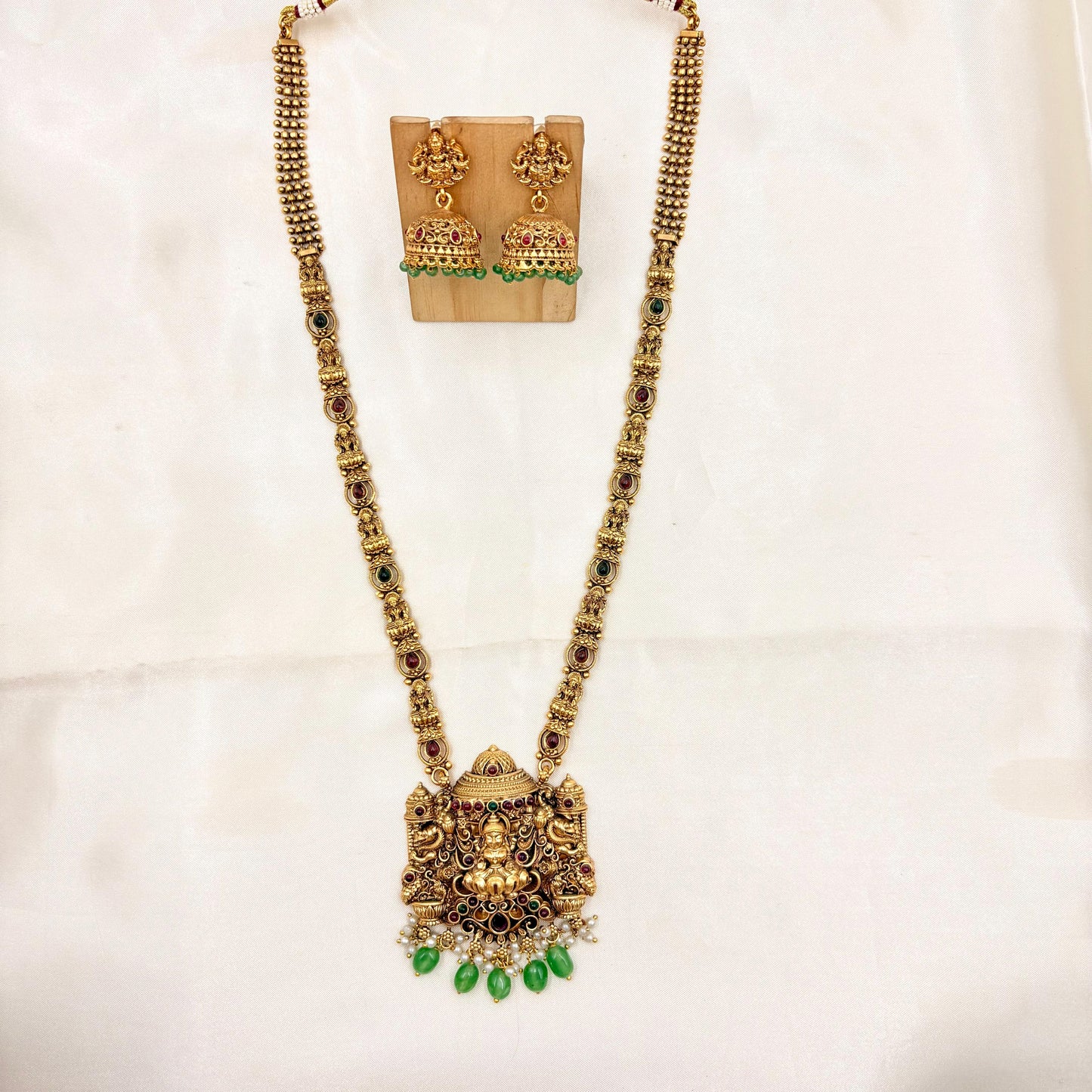Antique Gold Finish Lakshmi Temple Necklace with Green Bead Drops & Matching Jhumka Earrings