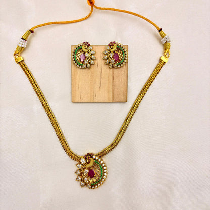 Traditional Peacock Pendant Necklace Set with Ruby & Green Stones – Gold Finish