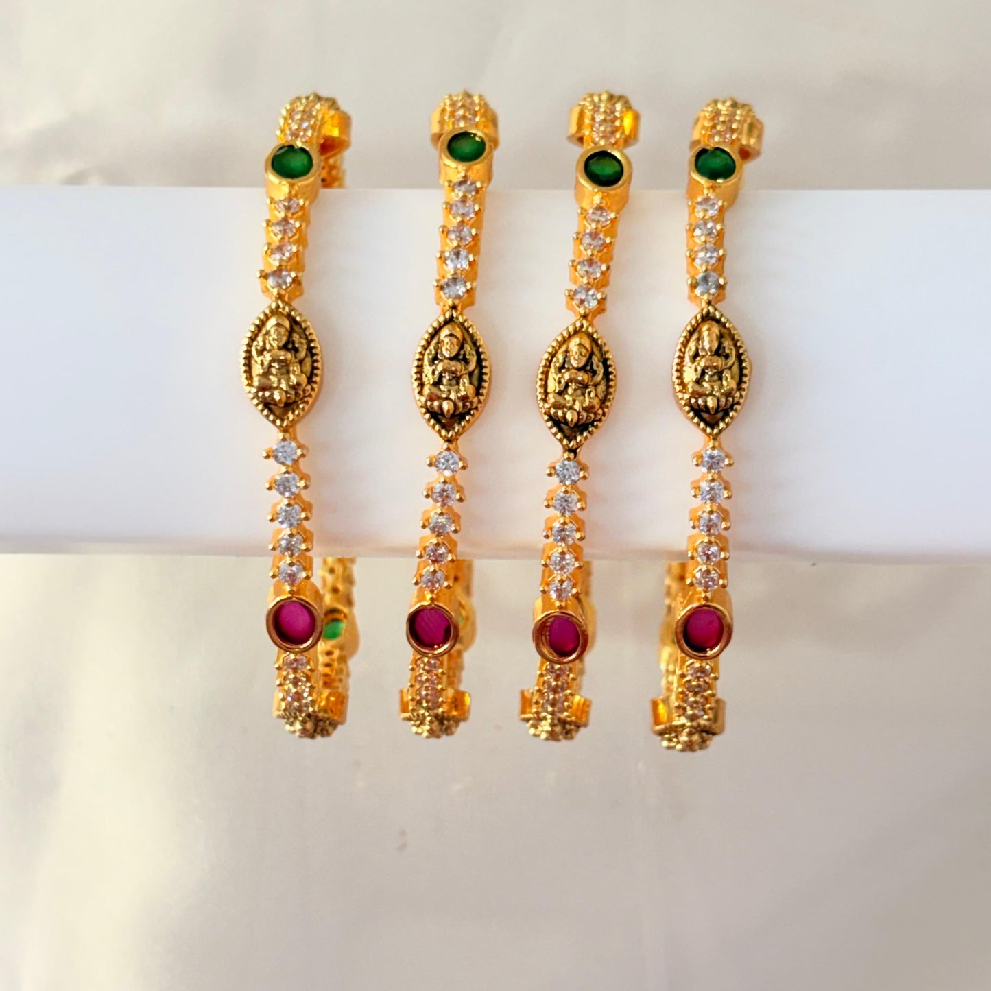 Gold-Plated Lakshmi Temple Bangles with Green & Ruby Stones – Traditional Bridal Design