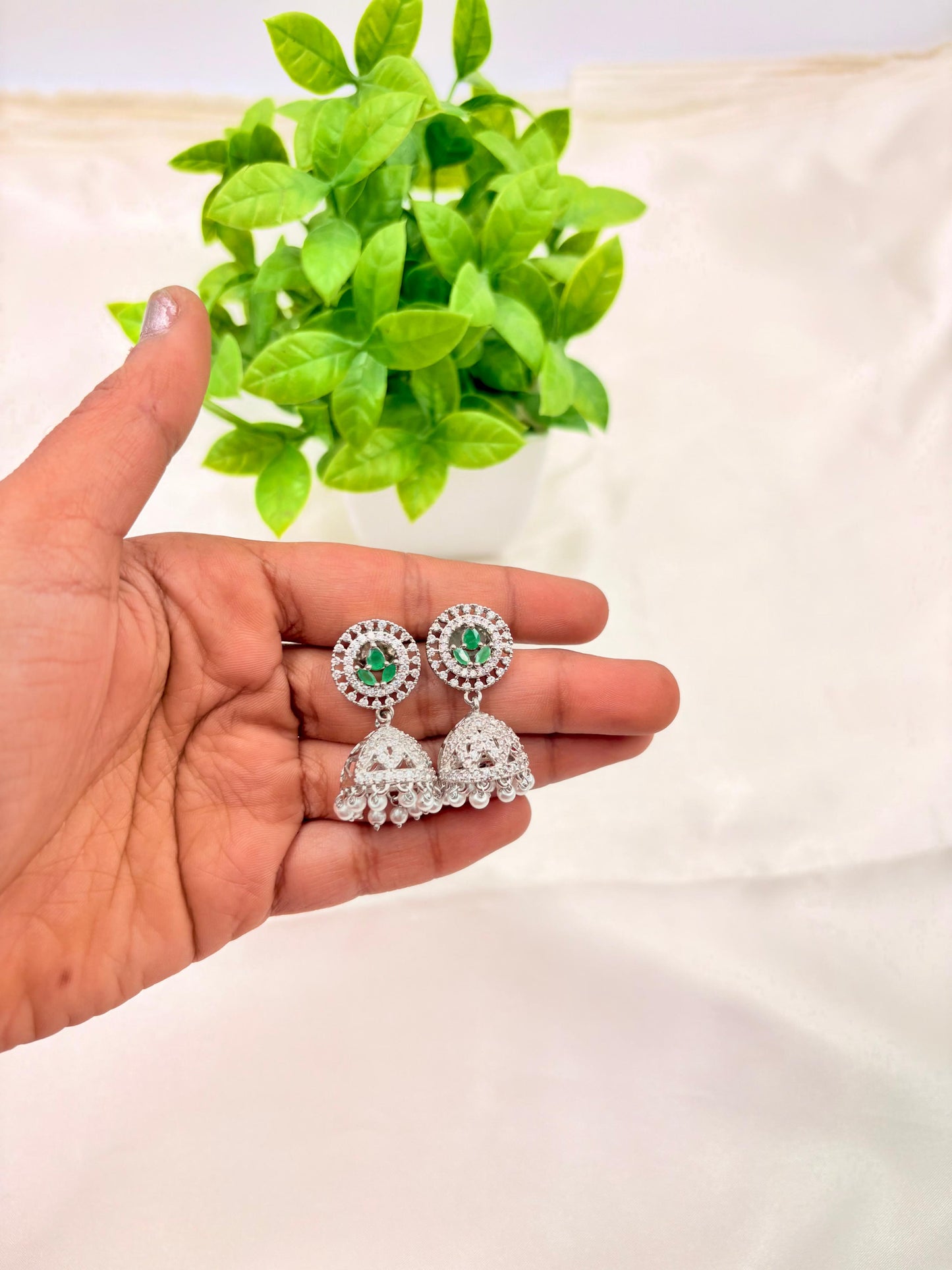 Silver Finish Green Stone Jhumka Earrings with Pearl Drops