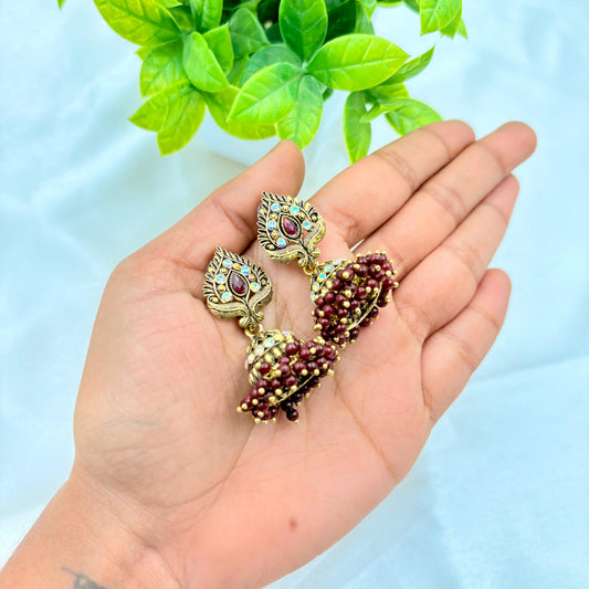 Antique Gold Peacock Jhumka Earrings with Maroon Beads