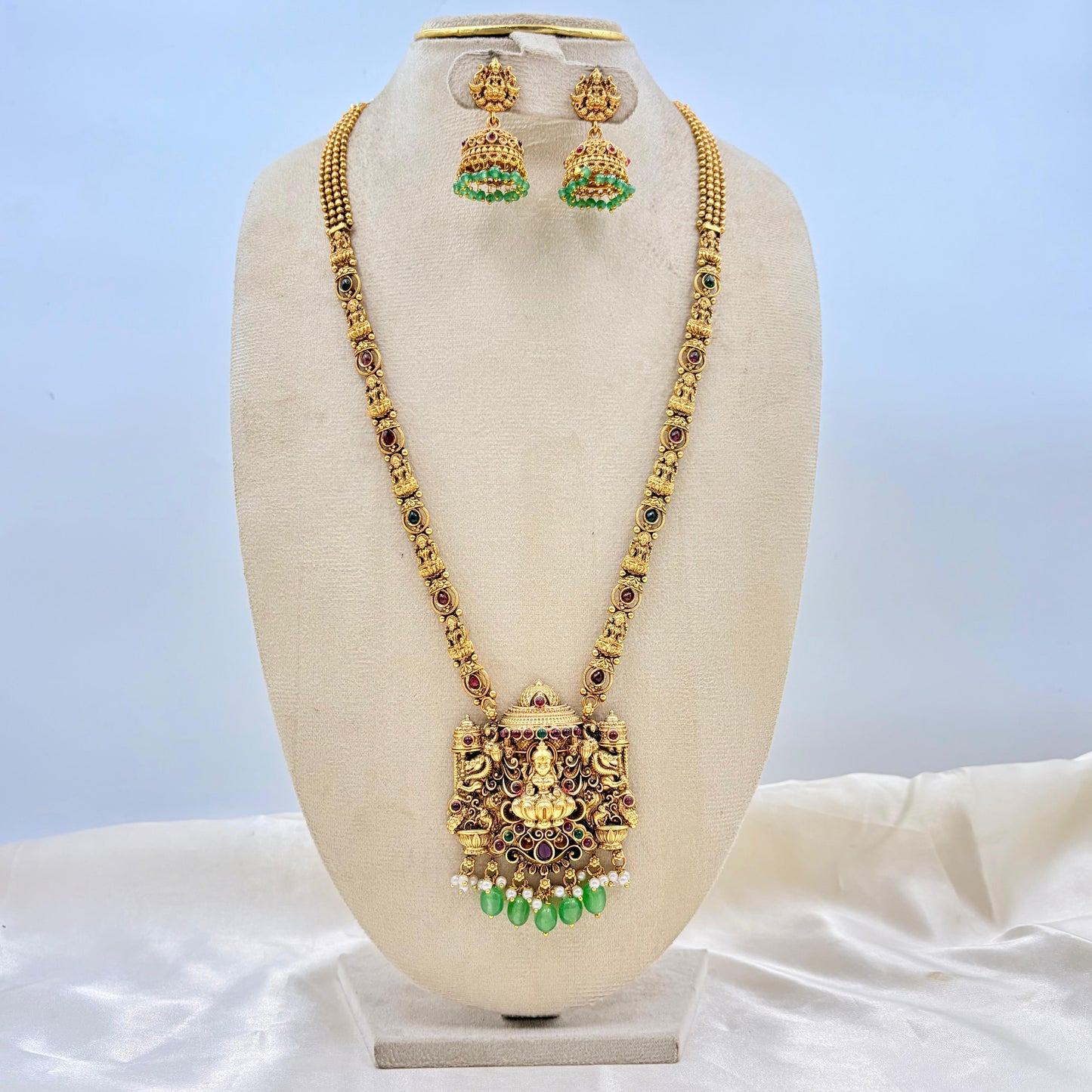 Antique Gold Finish Lakshmi Temple Necklace with Green Bead Drops & Matching Jhumka Earrings