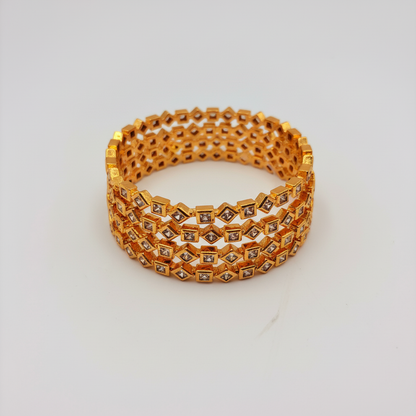 Geometric Diamond-Cut Gold Bangles – Premium CZ Stone Design