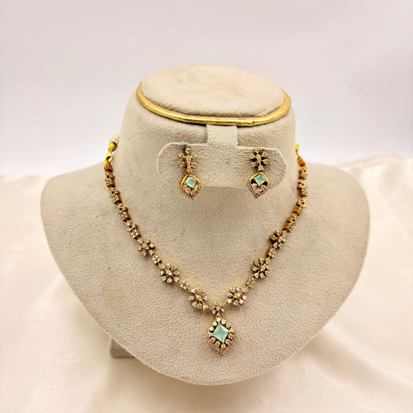 Elegant Floral CZ Necklace Set with Green Stone Pendant – Gold Finish