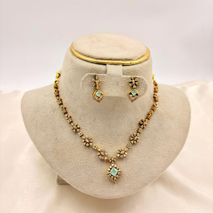 Elegant Floral CZ Necklace Set with Green Stone Pendant – Gold Finish