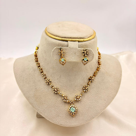 Elegant Floral CZ Necklace Set with Green Stone Pendant – Gold Finish