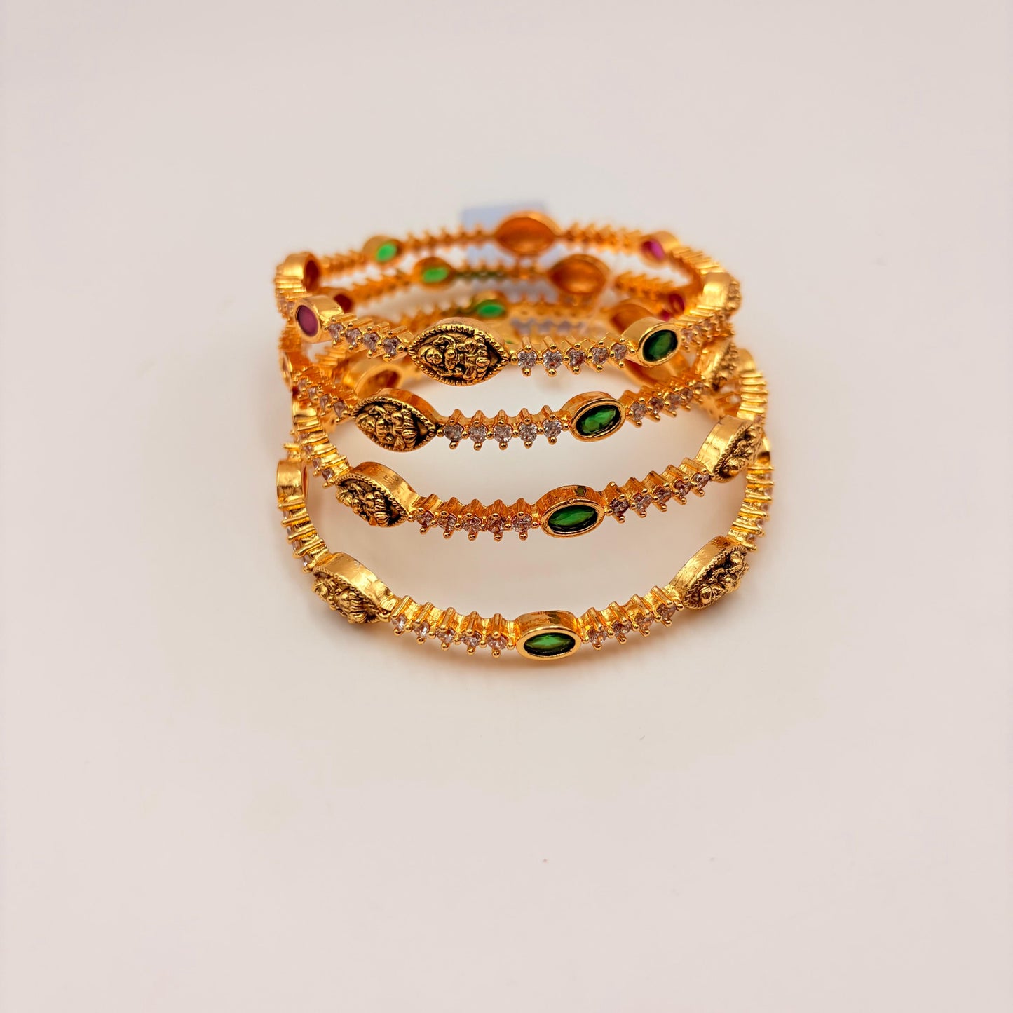 Gold-Plated Lakshmi Temple Bangles with Green & Ruby Stones – Traditional Bridal Design