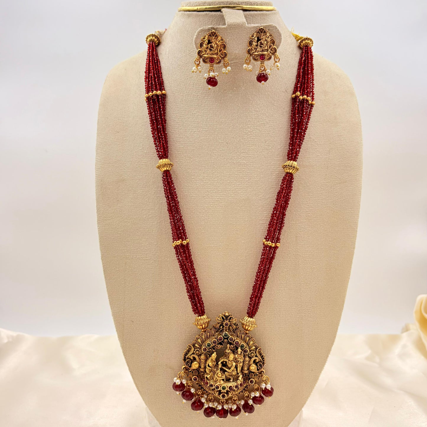 Temple Jewellery Red Beads Lakshmi Pendant Necklace Set with Jhumka Earrings | Antique Gold Finish