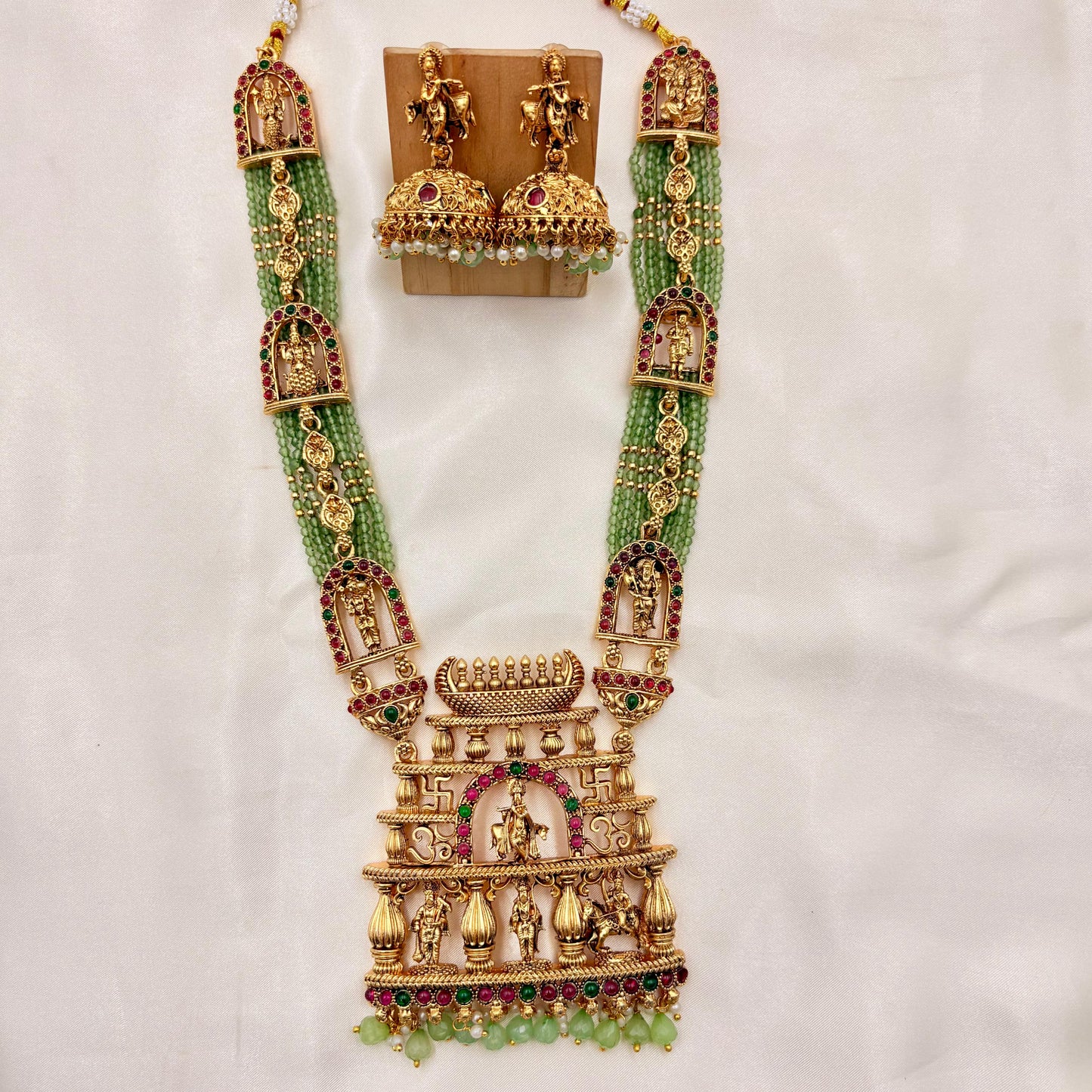 Grand Temple Jewellery Green Beads Haaram with Ram Darbar Pendant & Jhumka Earrings | Antique Gold Finish