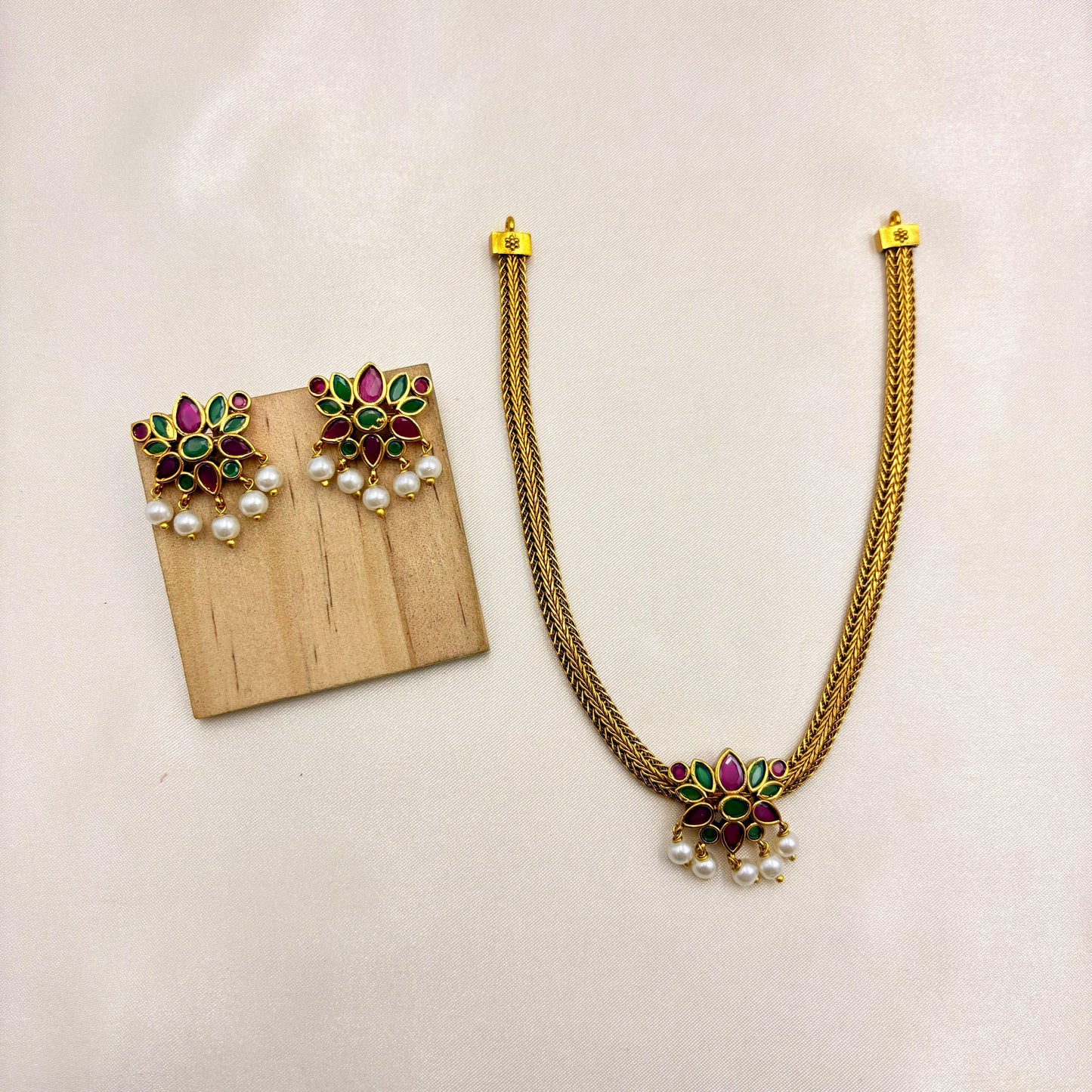 Floral Ruby & Emerald Pendant Necklace Set with Pearls – Traditional Gold Finish Jewellery