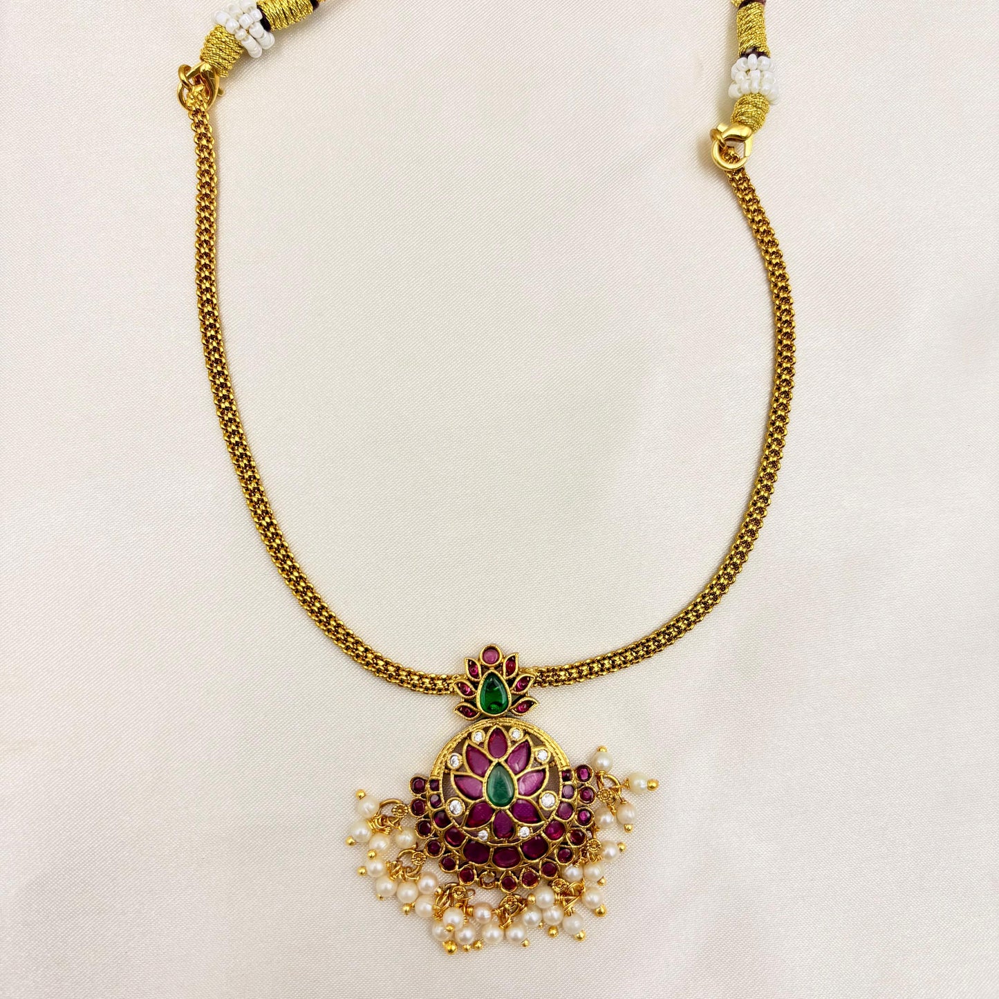 Gold Finish Ruby-Green Kundan Pendant Necklace Set with Pearl Drops
