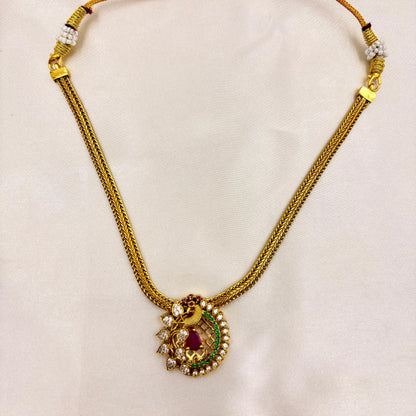 Traditional Peacock Pendant Necklace Set with Ruby & Green Stones – Gold Finish