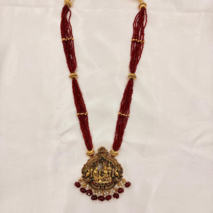 Temple Jewellery Red Beads Lakshmi Pendant Necklace Set with Jhumka Earrings | Antique Gold Finish