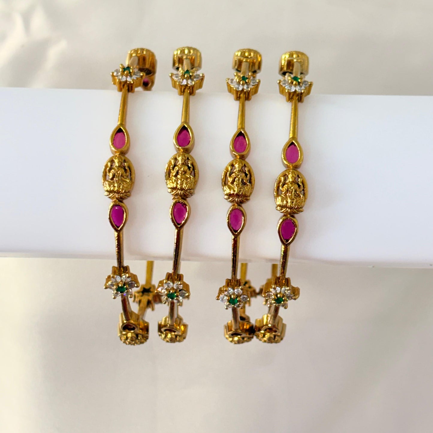 Temple Lakshmi Gold-Plated Bangles with Ruby & Green Stones – Traditional Bridal Wear (Set of 4)