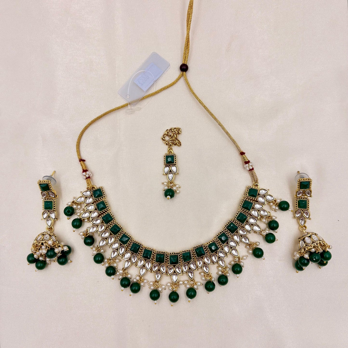 Gold Finish Green Kundan Necklace Set with Pearl Drops & Maang Tikka