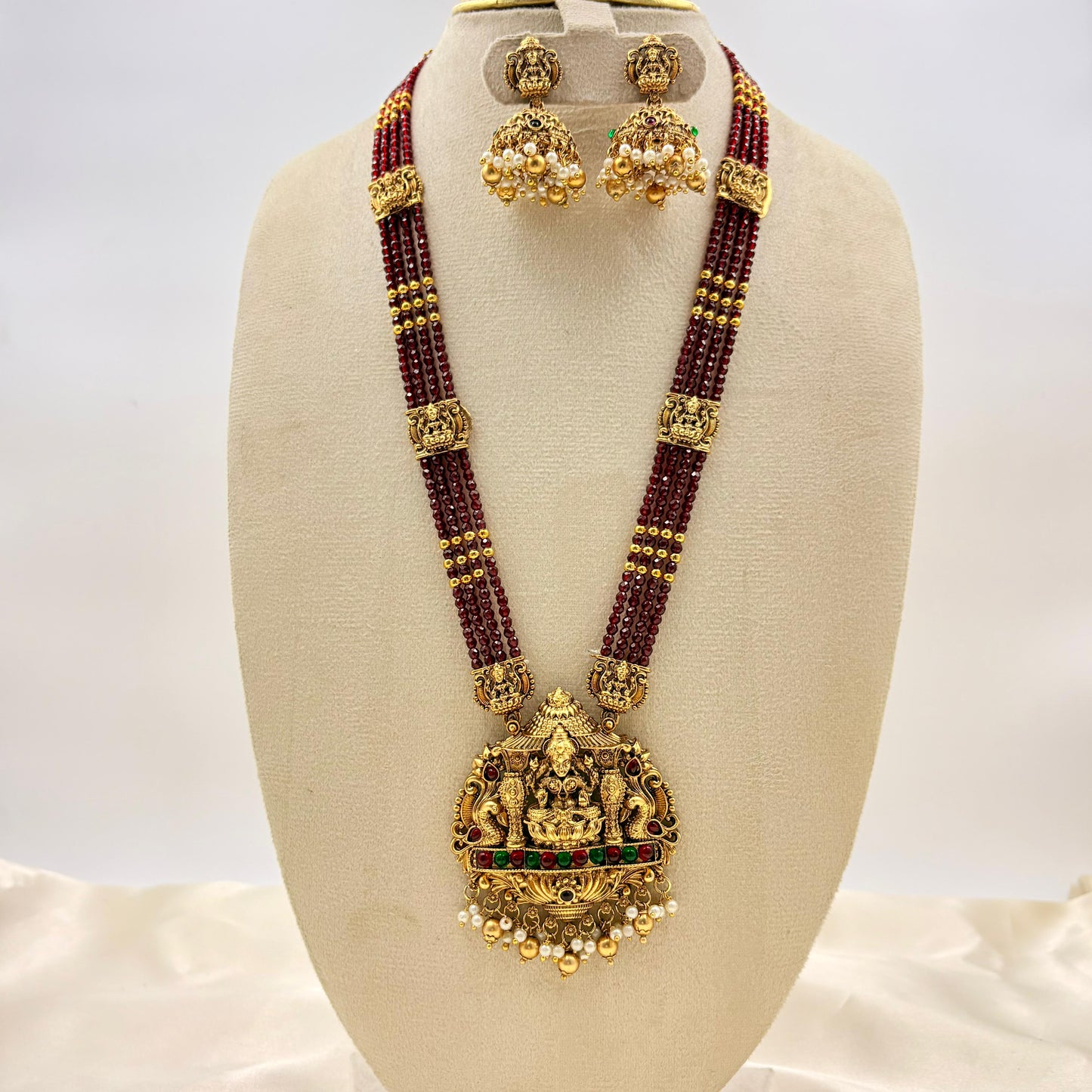 Red Beads Temple Haaram with Lakshmi Pendant & Jhumka Earrings | Antique Gold Finish