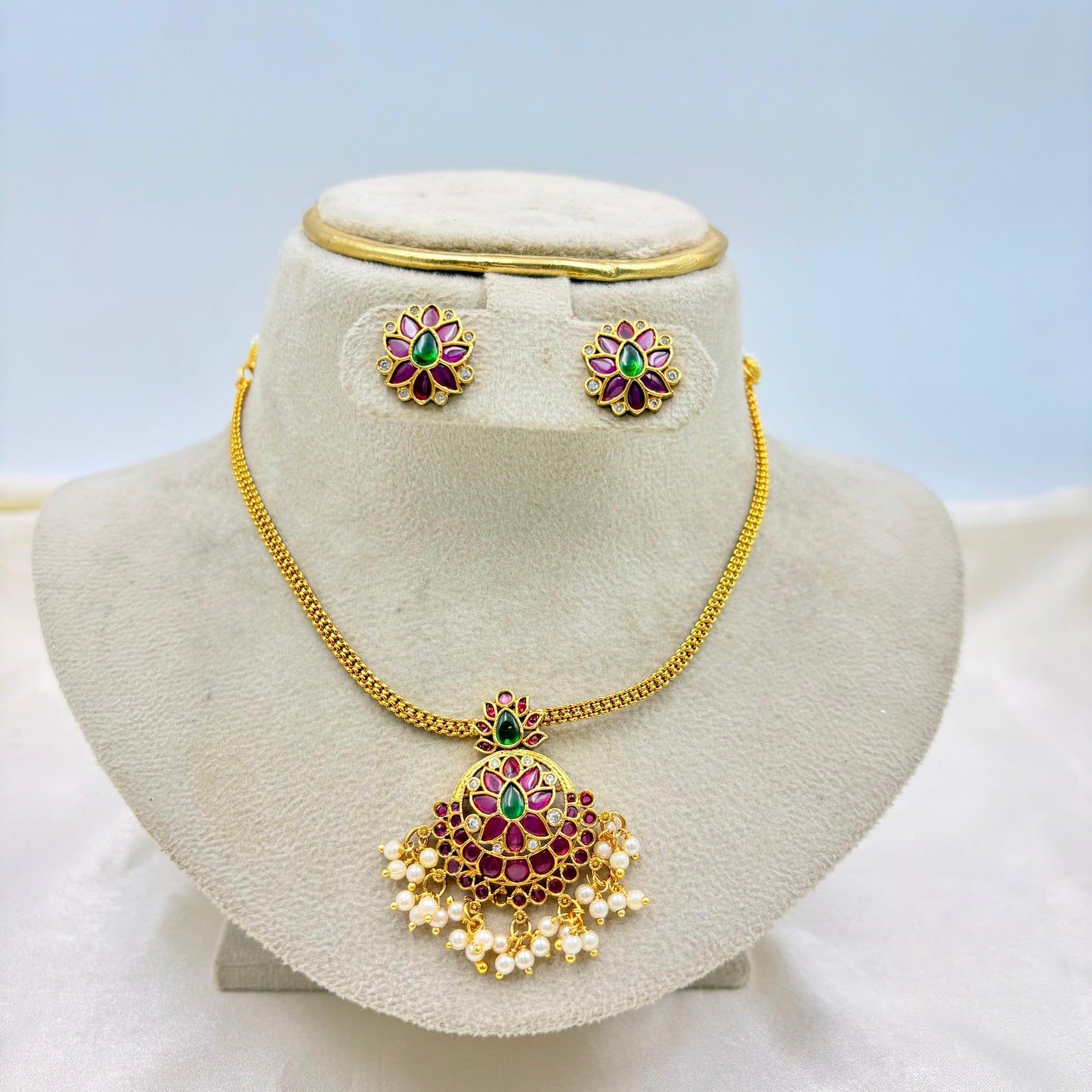 Gold Finish Ruby-Green Kundan Pendant Necklace Set with Pearl Drops
