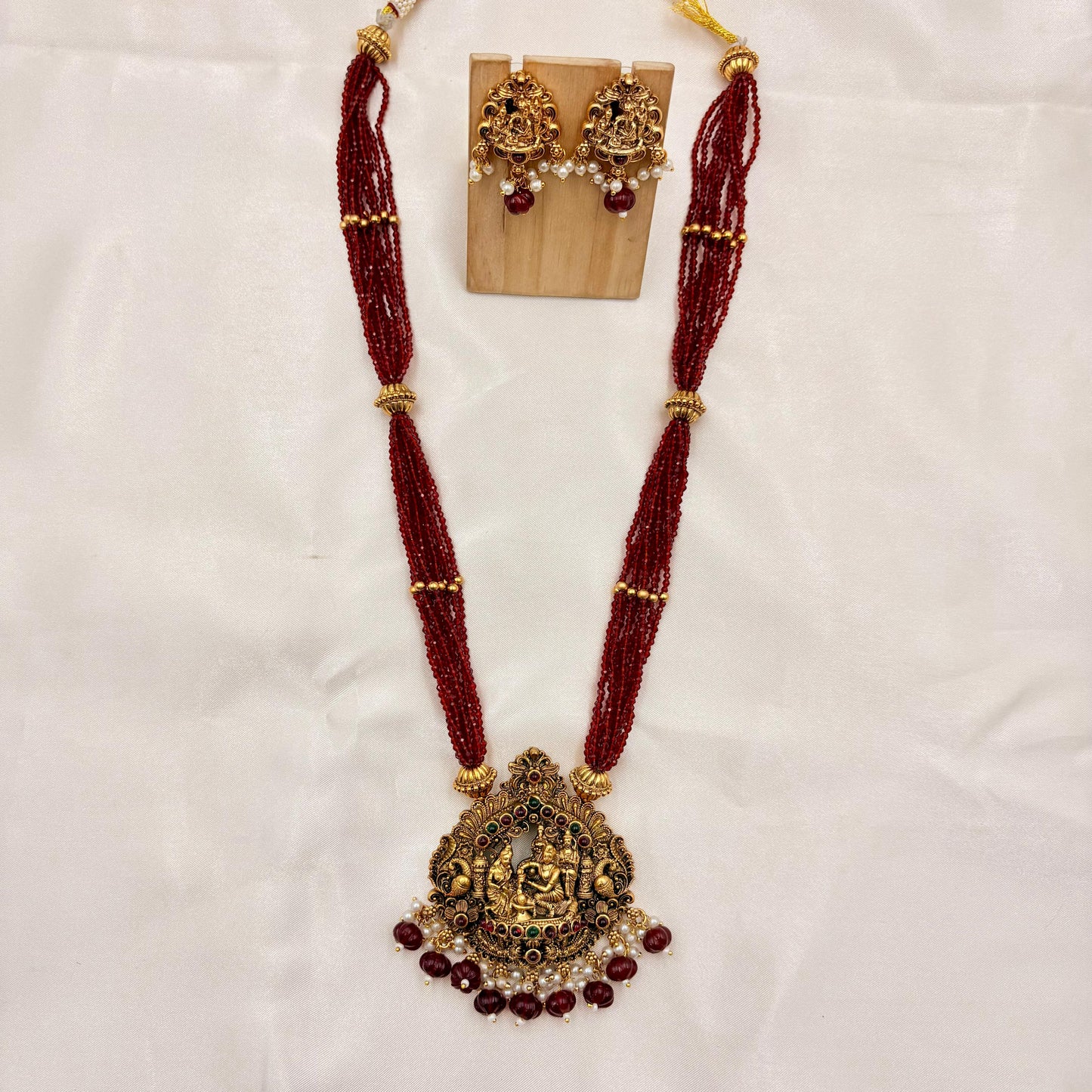 Temple Jewellery Red Beads Lakshmi Pendant Necklace Set with Jhumka Earrings | Antique Gold Finish