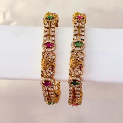 Gold-Plated Peacock Design Bangles with Ruby & Green Stones – Traditional Bridal Bangles