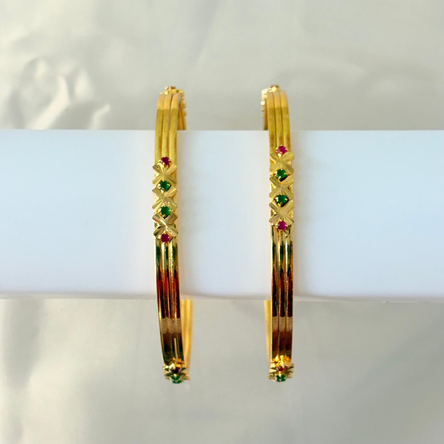 Gold Finish Geometric Stone Bangles with Ruby & Green Accents – Elegant Daily Wear Bangles