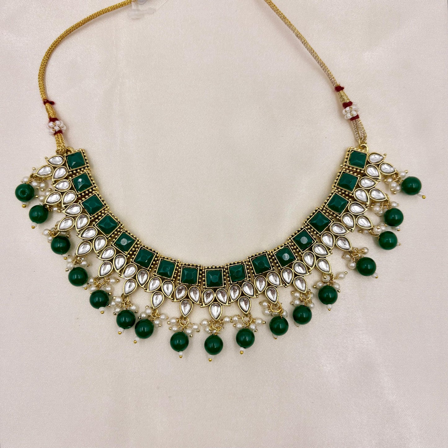 Gold Finish Green Kundan Necklace Set with Pearl Drops & Maang Tikka